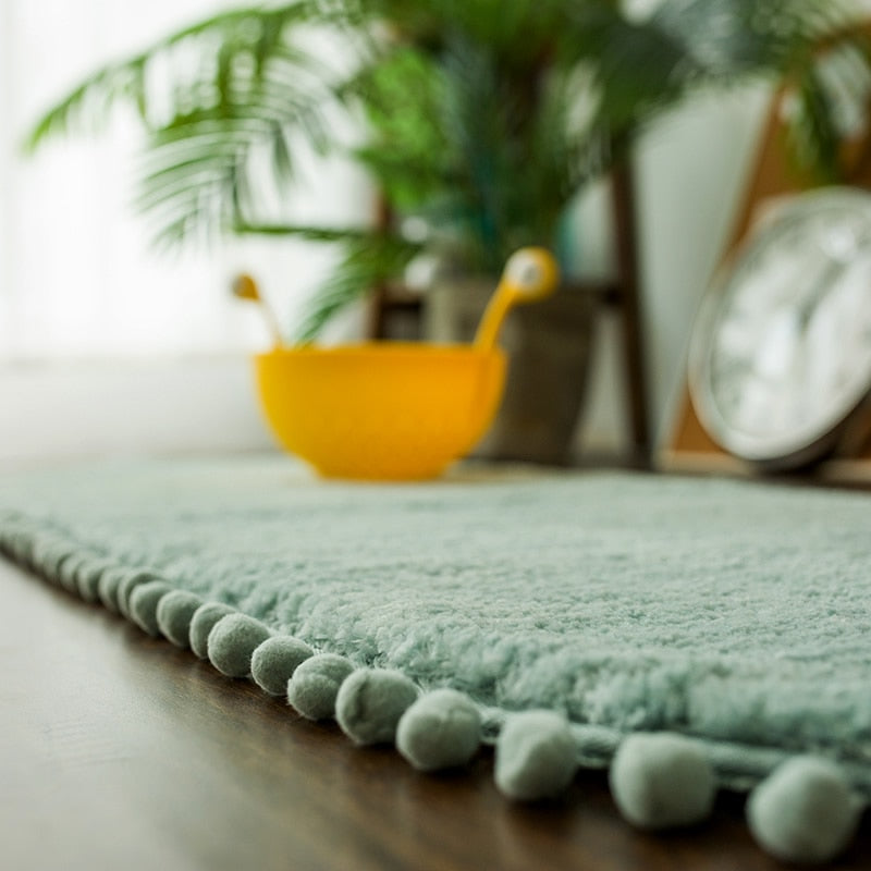 Ovale Badmat met Bommelrand van Polyester Antislip