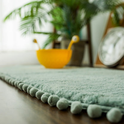 Ovale Badmat met Bommelrand van Polyester Antislip