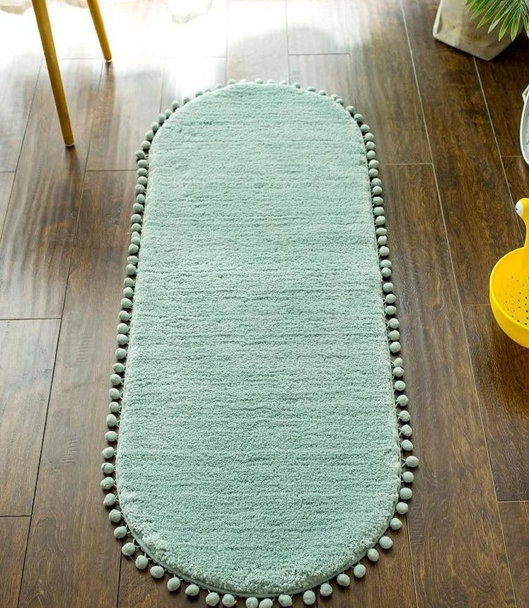 Ovale Badmat met Bommelrand van Polyester Antislip