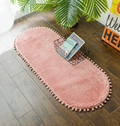 Ovale Badmat met Bommelrand van Polyester Antislip