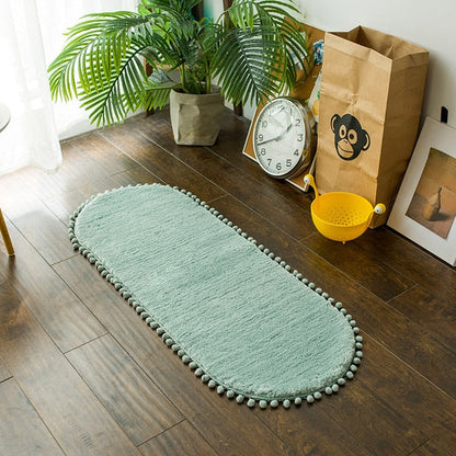 Ovale Badmat met Bommelrand van Polyester Antislip