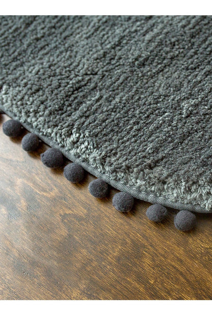 Ovale Badmat met Bommelrand van Polyester Antislip