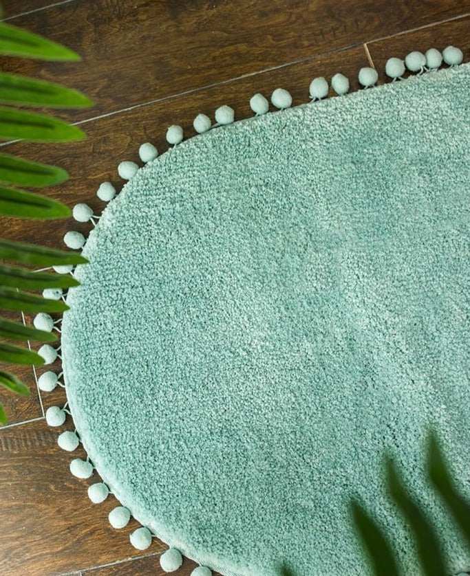 Ovale Badmat met Bommelrand van Polyester Antislip